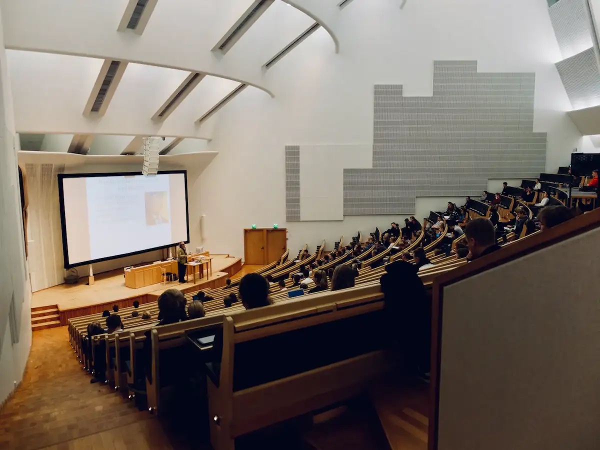 students in class in an auditorium