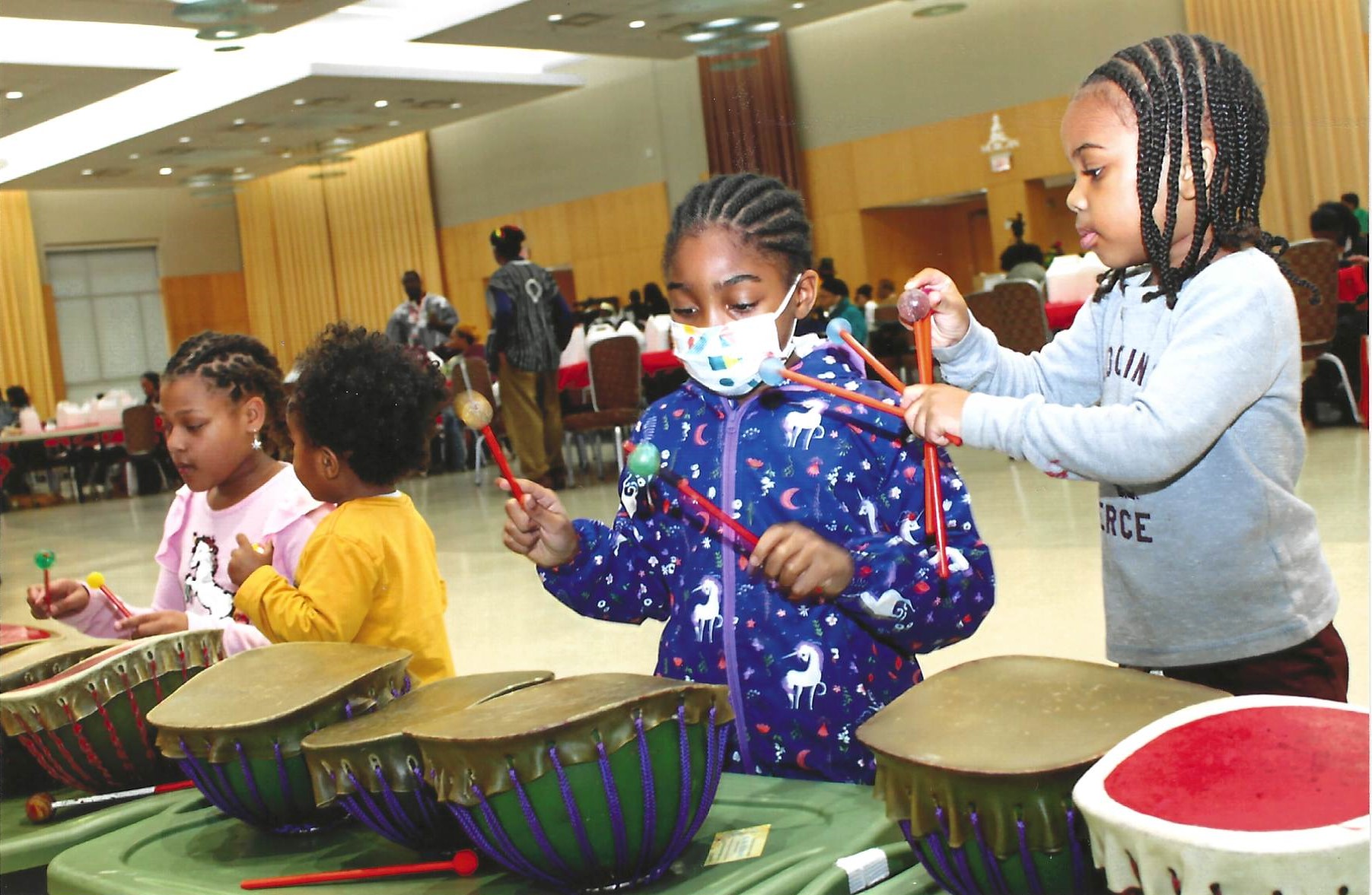 Children playing with drums