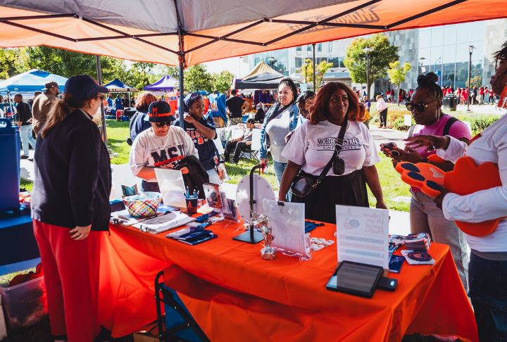 CICS staff mingling with prospective students at homecoming