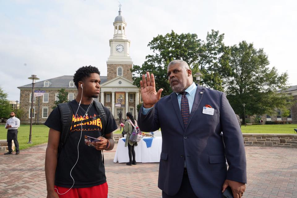 VP Kevin Banks talking to student