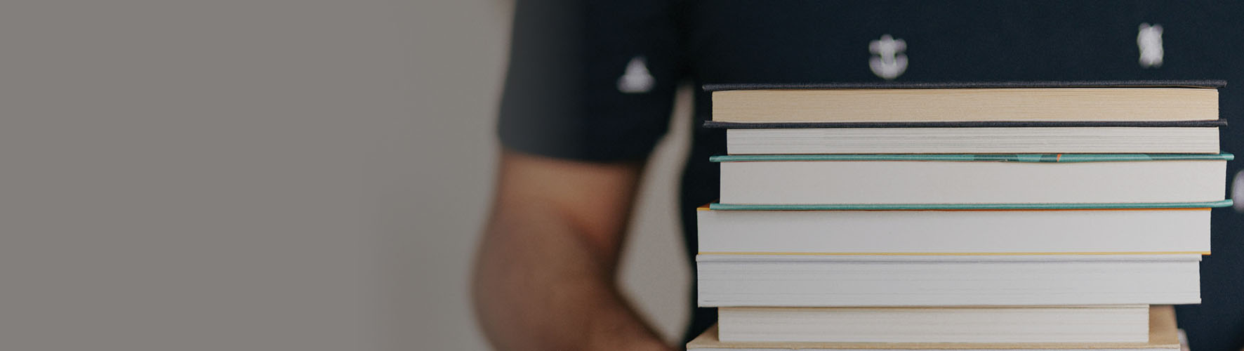 person holding books