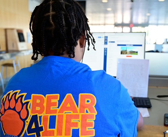 student wearing bear for life tee shirt