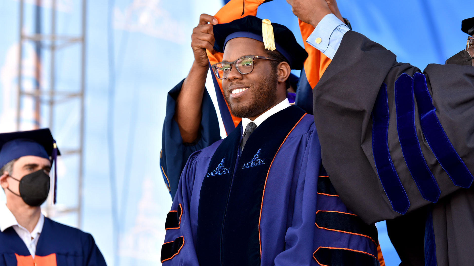 Doctoral student being hooded at commencement
