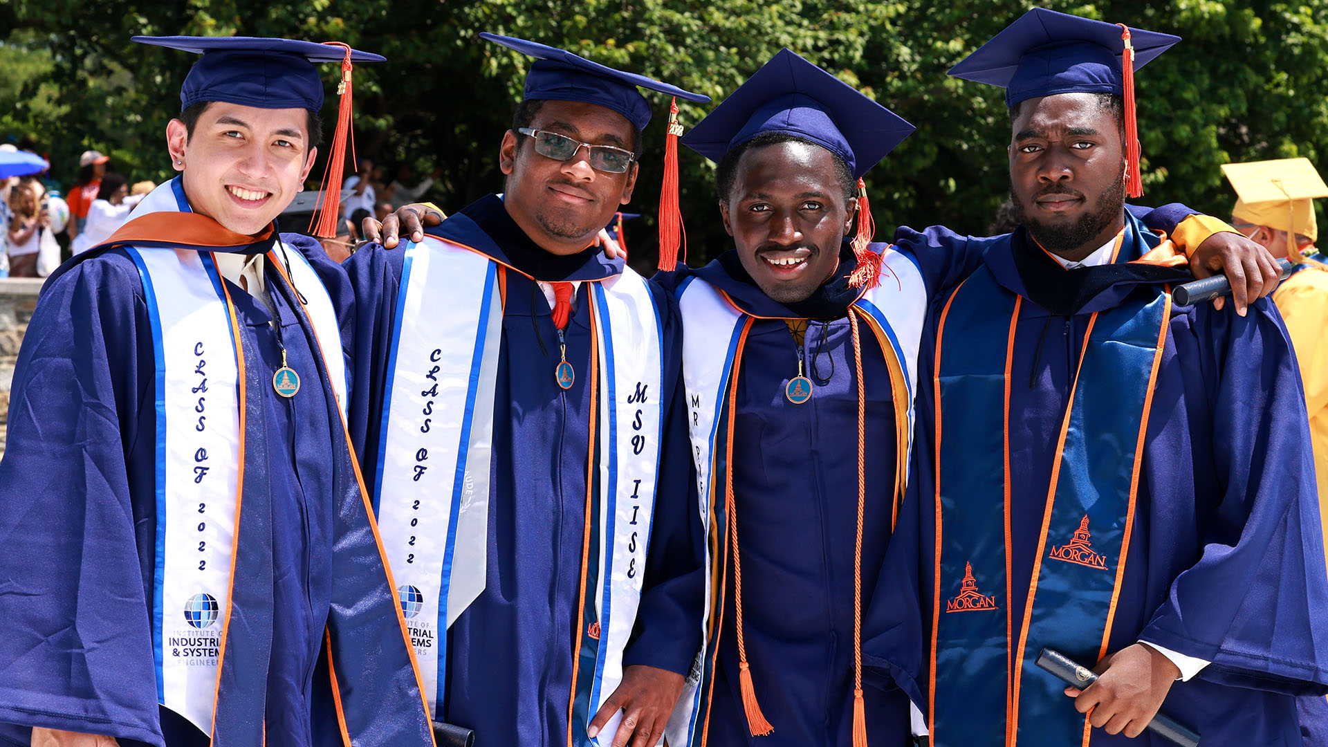 Four male graduating students at commencement services