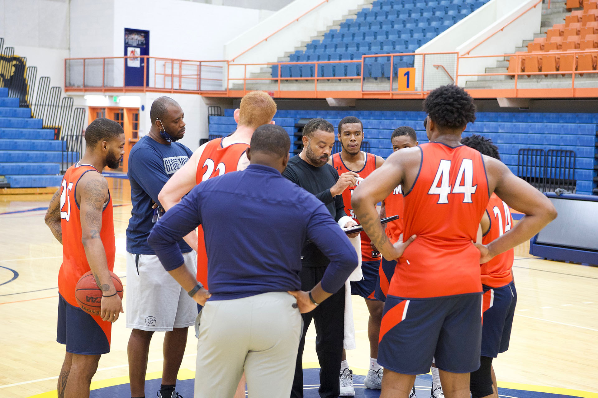 Coach Broadus with Basketball Team