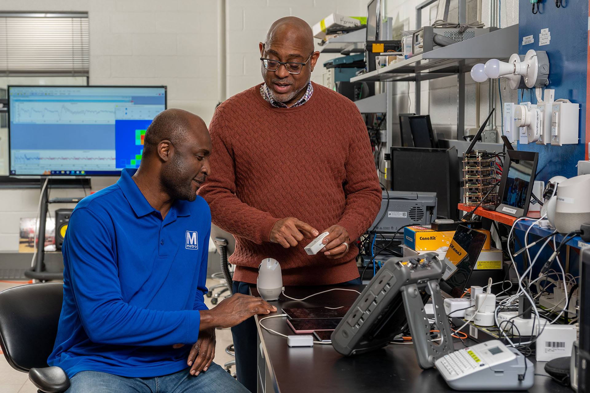 Kevin Kornegay, the director of the Cybersecurity Assurance and Policy Center, and a student. 