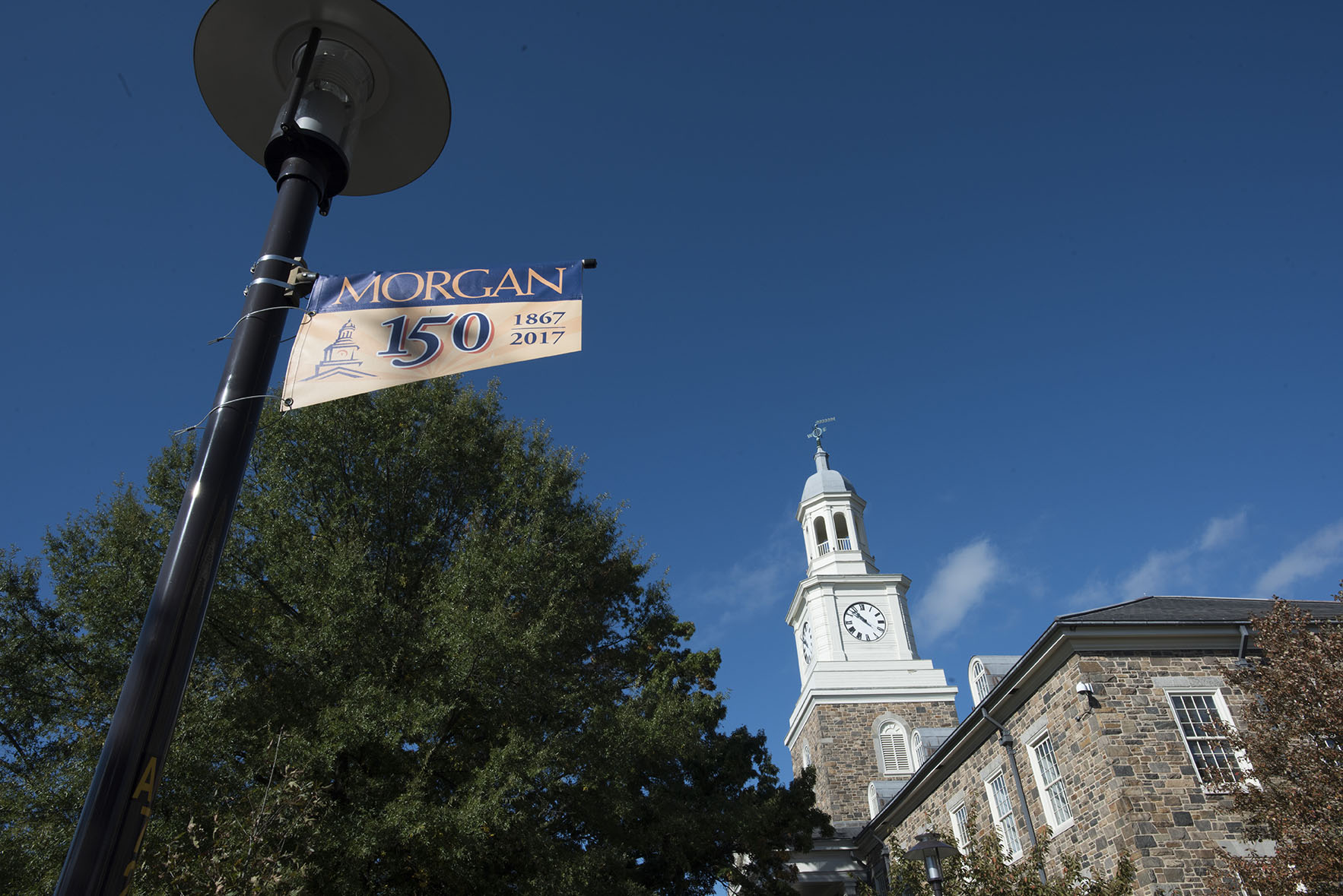 holmes hall with 150th lamp flag