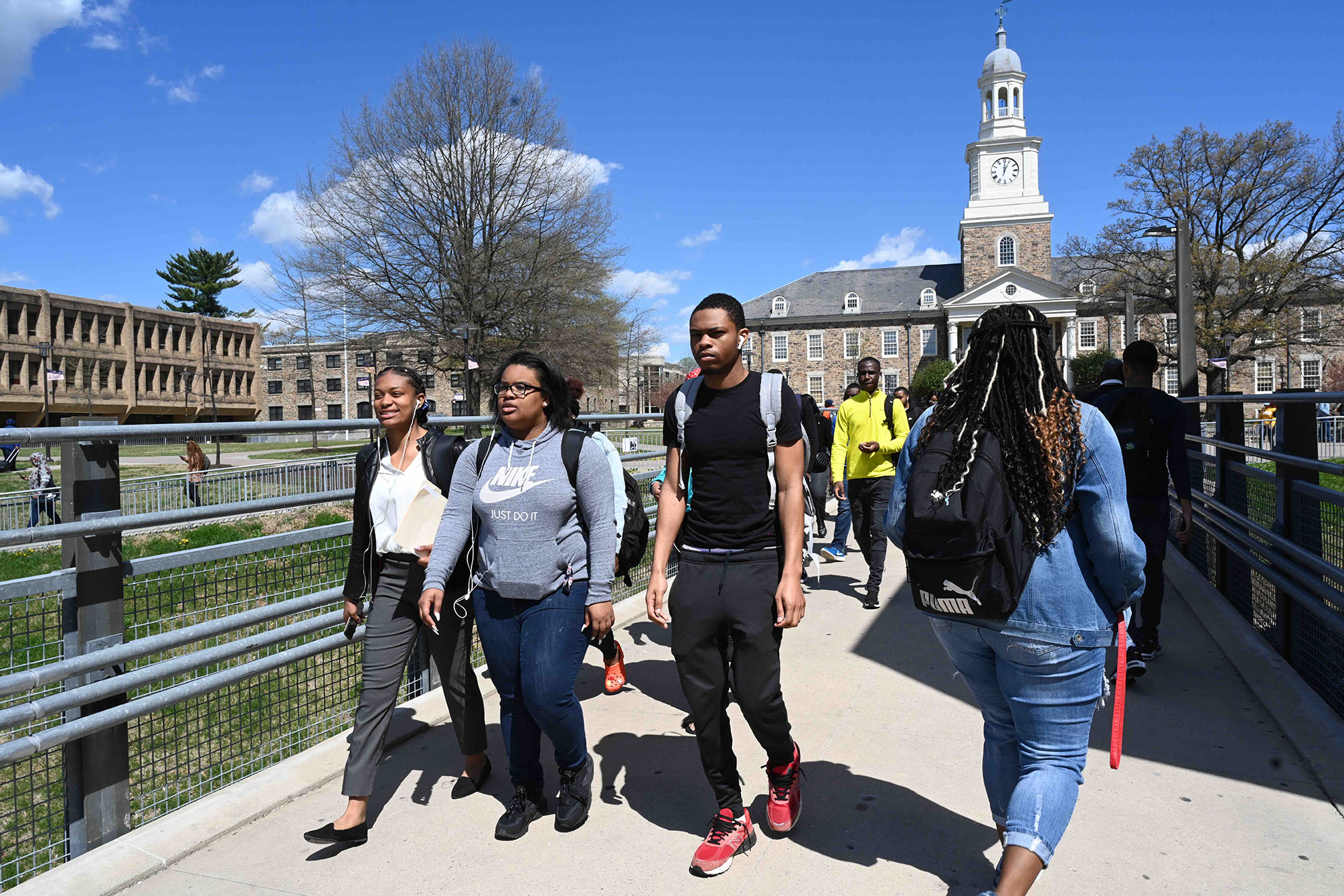 students walking on the bridge