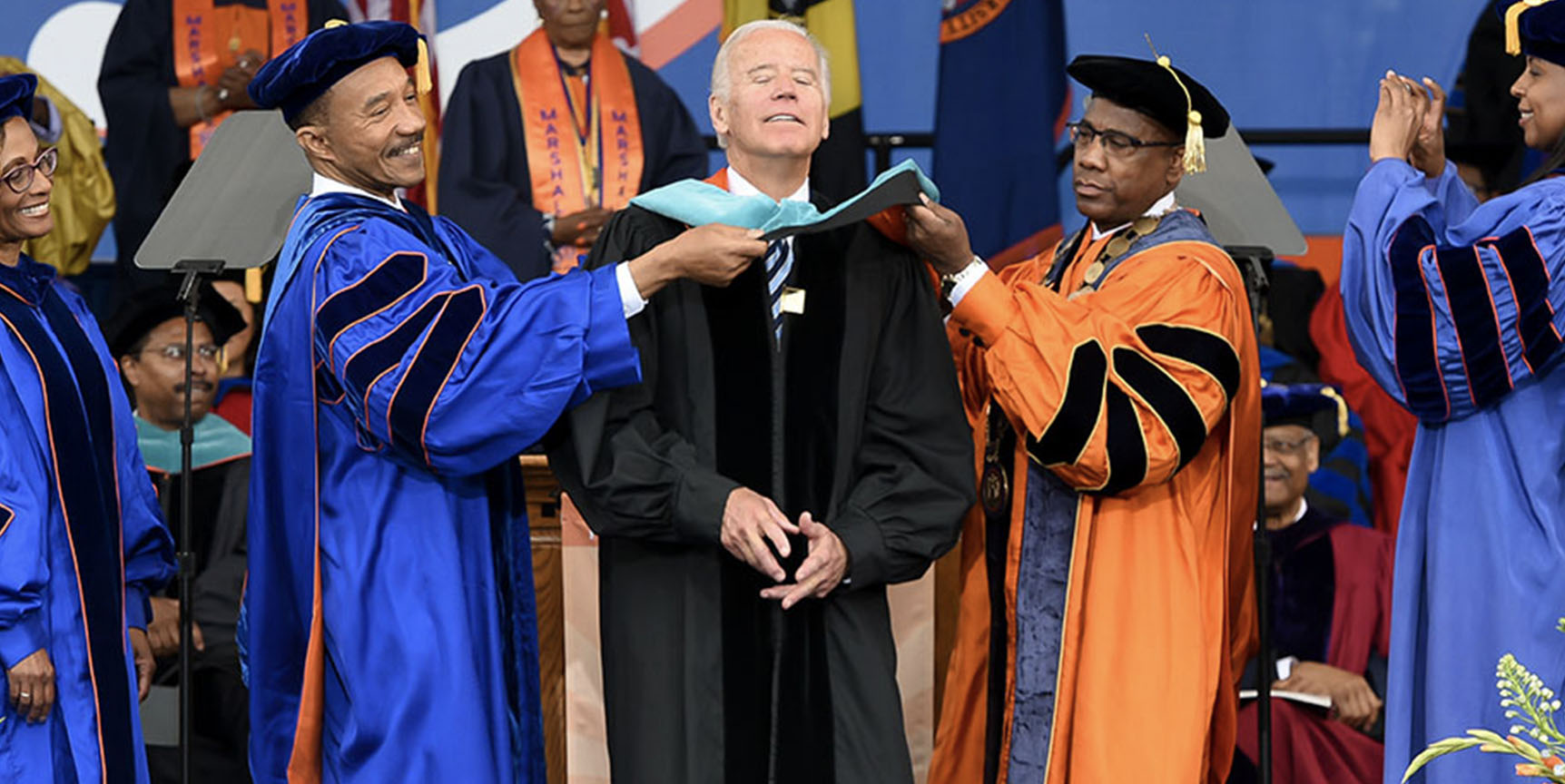Mfume and Wilson hooding Biden with honorary degree