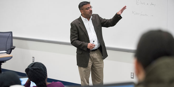 teacher teaching at a whiteboard