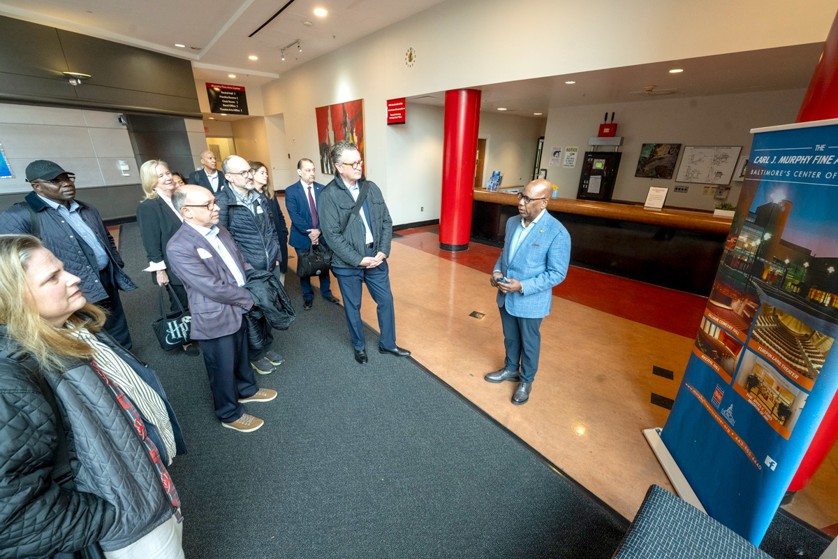 Morgan President David K. Wilson takes the visiting Lumina Foundation Board on a tour of the Murphy Fine Arts Center.