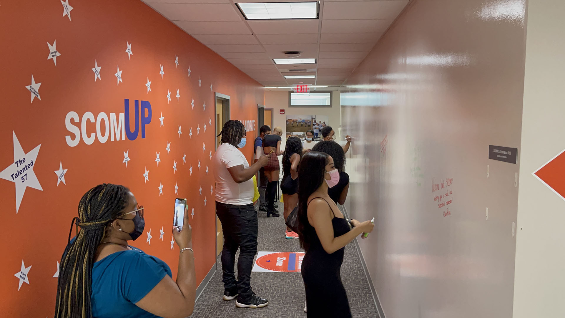 Strategic Communication students standing in the hallway