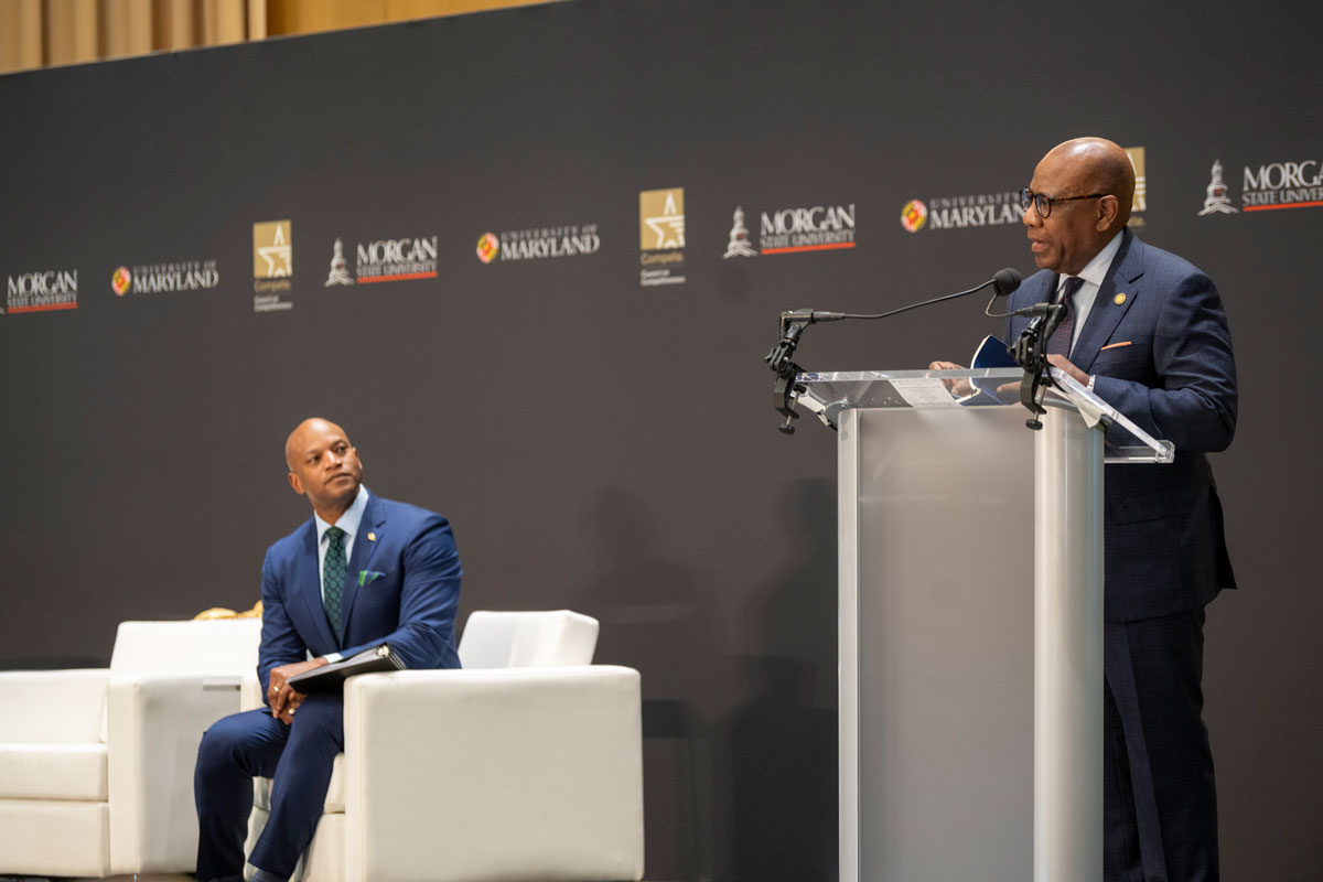 Gov. Wes Moore looks on as Morgan President David K. Wilson introduces the keynote speaker