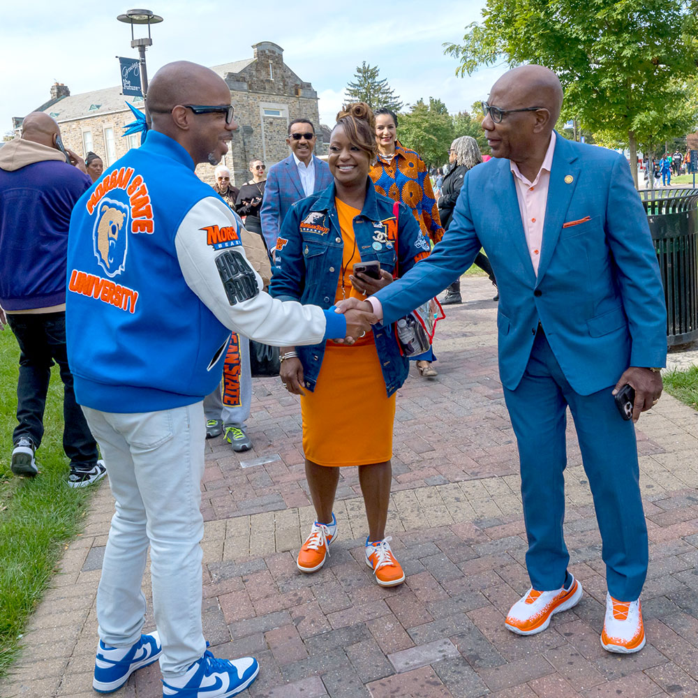 Morgan President David Wilson walks the campus on Homecoming Day, greeting visiting alumni and guests.