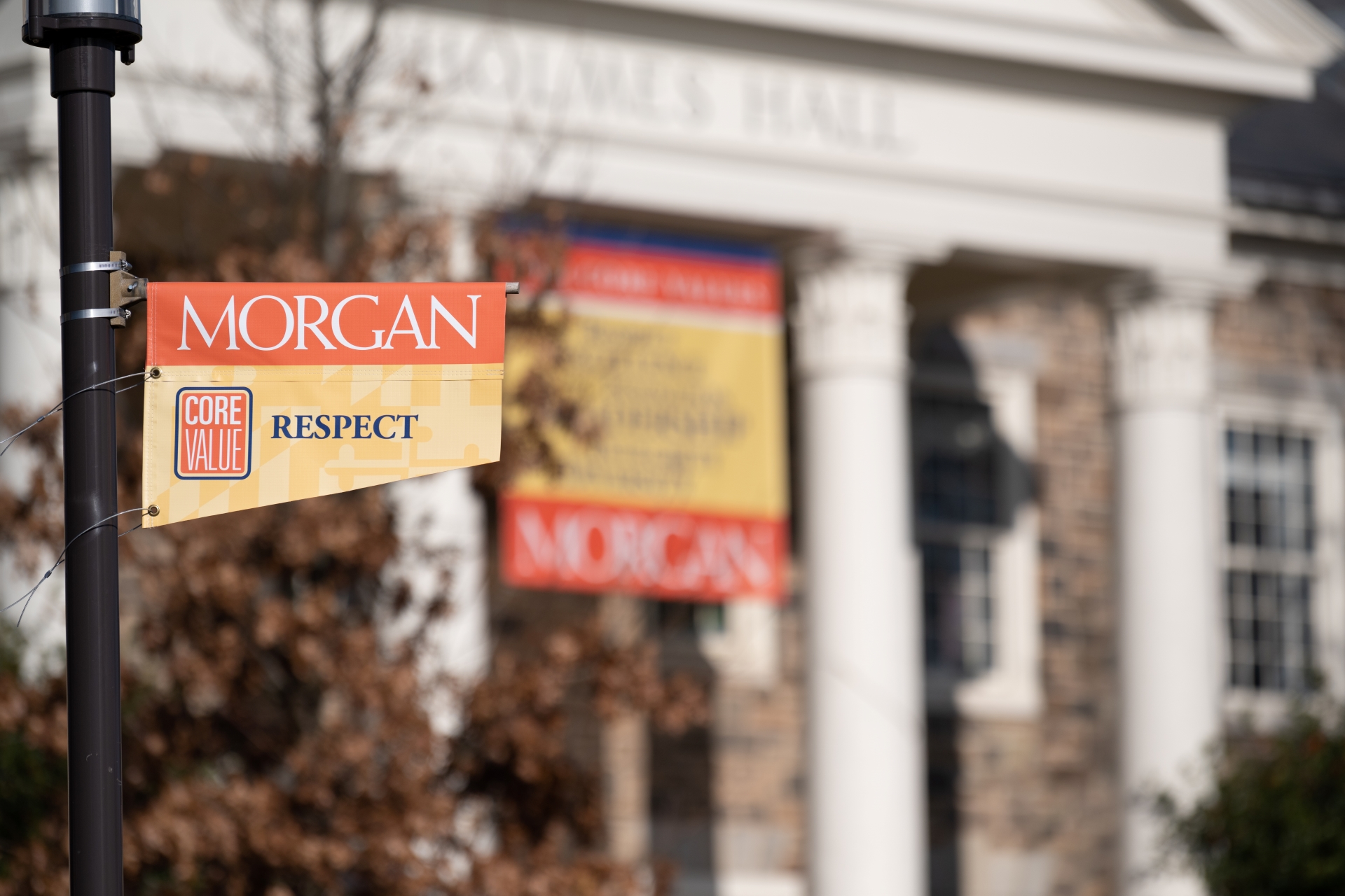 Morgan core value flag in front of Holmes Hall