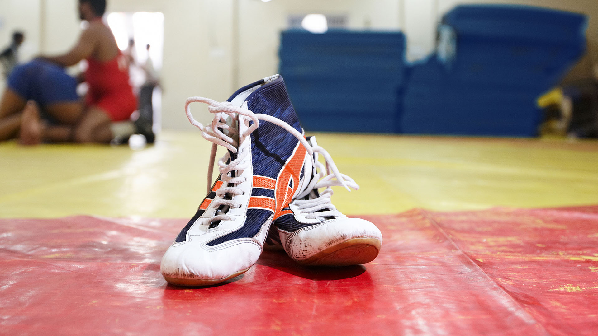 wrestling shoes on a gym floor