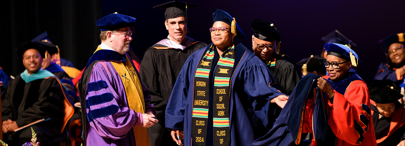 Student a staff at graduation